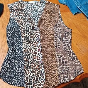 Beautiful silk vest like blouse. Size medium animal print